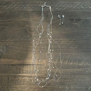 Matching necklace and earrings set. Black/silver coloring